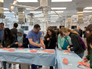 Brian Quaranto, MD, a 2nd year surgical resident, teaching individuals to suture at the annual Buffalo Niagara Medical Campus Open House. 