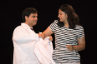 Neha Navneet Sharma smiles as she receives her white coat, a symbol of her future profession.