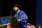 Student speaker Jason Edwards mixed humor with passion as he spoke about his journey through medical school as the “last member of the class.”