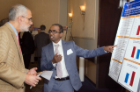 Nephrology fellow Edwin Anand, MD, right, points out a key section of his research to Alan J. Lesse, MD, senior associate dean for medical curriculum.