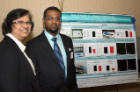 Jessy J. Alexander, PhD, research professor of medicine, left, and Yonas Redae, BS, are pictured with his research poster presentation.