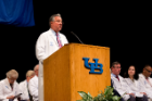 Michael E. Cain, MD, dean of the Jacobs School of Medicine and Biomedical Sciences, welcomes the Class of 2020 during the White Coat Ceremony.