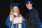 Victoria Gosy was awarded the Biomedical Sciences Outstanding Senior Award. With her is program director David E. Shubert, PhD, assistant dean of biomedical undergraduate education.