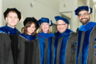 From left, graduates Laurie Rich and Krista Belko celebrate with Roswell Park Comprehensive Cancer Center President and CEO Candace S. Johnson, PhD, and Roswell faculty members Gerald Fetterley Jr., PhD, and Mukund Sehsadri, DDS, PhD.