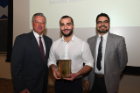 The Ernest Witebsky Award, which recognizes high grades in microbiology and immunology, was given to Matthew Kabalan (center). He accepted the award from John C. Panepinto, PhD (right), and Michael E. Cain, MD. 