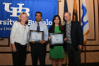 Abhishek C. Sawant, MD, MPH, cardiovascular disease fellow (second from left), and Aishwarya Bharadwaj, MD (second from right), internal medicine resident, receive their oral presentation awards for best clinical research from Anne B. Curtis, MD (left), and Jeffrey M. Lackner, PsyD (right).