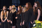 The Royal Pitches perform the national anthem at the biomedical sciences commencement ceremony at the Center for the Arts. 