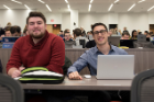 Michael Owitz, left, and Iain Thompson are all smiles on the first day of classes as they settle into a new, state-of-the-art lecture hall. 