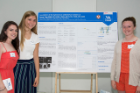From left, Amherst High School students Natalie Miller, Isabel Steimle and Tessa Decicco with their research poster presentation.