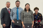 Andrew Baumgartner and Emily Zhou were the recipients of the Adelaide and Brendan Griswold Scholarship given to those who show promise and strong interest in becoming a family medicine or primary care physician. At left is Michael E. Cain, MD, and at right is Kim Strong Griswold, MD.