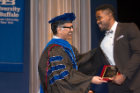 Kerri Damion Pryce, PhD ’18, receives the Dennis Higgins Award for PhD Dissertation Research in Pharmacology and Toxicology from his mentor, Arin Bhattacharjee, PhD. 