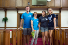 Cleaning up the interior of the Macedonia Baptist Church was on the day’s “to do” list for medical students, from left, Quinn Magiera, Lorna Krabill, Alina Gandrabur and Meghan Long.