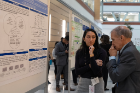 Second-year medical student Ashtah Das discusses her research poster with Charles M. Severin, MD, PhD.