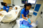 Scenarios cover the full range of medical situations, from admission through inpatient care and follow-up. Here, nursing students work with a mother and child immediately after delivery.