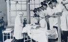 University Archives photograph of a Grand Rounds session at the Medical School.