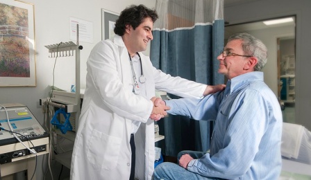 Jad Z. Bou-Abdallah, MD, with a patient. 