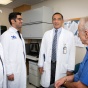 Sanjay Sethi, MD, sees a patient with Ravi Savani, MD, and Mohamed Gashouta, MD. 