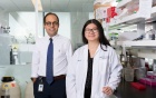 Student and faculty with research equipment