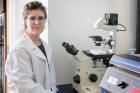 A student researcher sets up an experiment.
