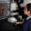 A pharmacology and toxicology student works on an experiment in the lab of Ji Li, PhD