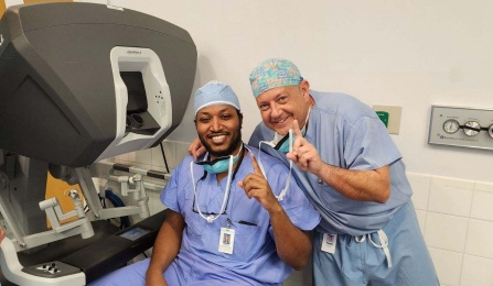 Colorectal surgery fellow and attending pose before surgery. 