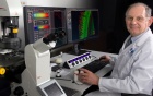 Ray Kelleher, left, and Wade Sigurdson, middle, examine a sample with a student in the Flow Cytometry and Cell Sorting facility.