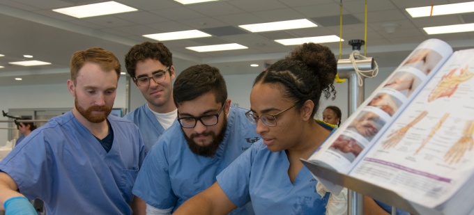 Students work in the gross anatomy lab. 