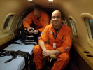 Flight Physician Justin Savage (right) prepares for a transfer aboard Mercy Flight's Learjet.
