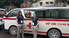 EMS Fellows Drs. Innes & Tanaka in front of a Vietnamese ambulance.