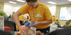 Student learning CPR during CPR/BLS training.