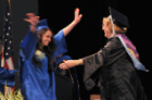 A baccalaureate candidate beams with excitement and joy as Carol K. Golyski, PhD, congratulates her at the biomedical sciences commencement ceremony.