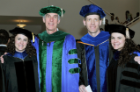 Sisters Cara (left) and Emily Clementi celebrate their new degrees with faculty members Timothy F. Murphy, MD, and Anders P. Hakansson, PhD (right).