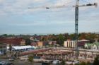 UB’s eight-story medical school will emerge on a two-acre site near the white tent at left.