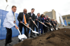 Medical student William Stendardi (far left) joins public officials and UB leaders, alumni and supporters in breaking ground.