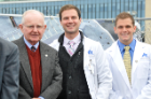 Ronald E. Batt MD, PhD (far left), professor of obstetrics and gynecology, looks to the future with medical students Jason Goldstein and William Stendardi.
