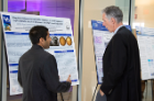 Jay Amin (left) shares his research findings with Timothy Murphy, MD.