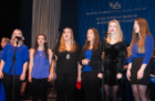The Royal Pitches, UB’s only all-female a cappella singing group, performs during the commencement ceremony.