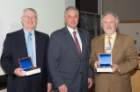 Michael E. Cain, MD, presented the Dean’s Award to John E. Tomaszewski, MD (left), and Anthony A. Campagnari, PhD (right).