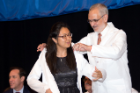 Incoming medical student Samantha Eng is coated by Alan J. Lesse, MD, senior associate dean for medical curriculum.