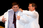 Incoming medical student Alexander Loftus is coated by his father, Randy Loftus, MD.