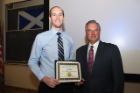 Luke Degraaff (left), who achieved one of the highest averages in biochemistry, was honored with an Edward L. Curvish, MD, Award for Excellence in Biochemistry. Michael E. Cain, MD, offered congratulations.