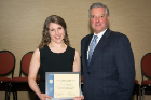 Sarah Morse, a 2016 inductee, received the Dr. Howard R. Goldstein ’74 Memorial Humanitarian Scholarship, presented by Michael E. Cain, MD, vice president for health sciences and dean of the Jacobs School of Medicine and Biomedical Sciences.
