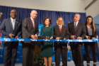 Byron Brown, Jeremy Jacobs, Kathy Hochul, Satish Tripathi, Michael Cain, MD, and Laura Reed prepare to cut the ribbon at the grand opening of the new medical school building.