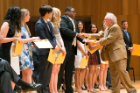 Anthony A. Campagnari, PhD, professor of microbiology and immunology, presents awards to students from the Class of 2017.
