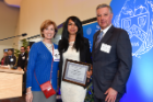 Resident Asma Mursleen, MD (center) — with Roseanne C. Berger, MD (left), and Michael E. Cain, MD — was honored for her research at the 20th annual Scholarly Exchange Day.