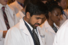Pramod Rao reads the Oath of Medicine with his classmates during the White Coat Ceremony.