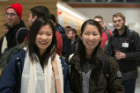 Lan Le, left, and Tae Hee Kim cannot hide their enthusiasm as they walk through the Jacobs School of Medicine and Biomedical Sciences during the first day of classes in the new building.