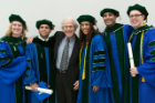 From left, Kelsey E. Monteith; Jose Alberto Baez; Murray J. Ettinger, PhD; Sara Gonzalez; Reza Garajehdaghi and Bryan Egan Bunnell celebrate after the commencement ceremony. Ettinger, a SUNY Distinguished Teaching Professor Emeritus of biochemistry, served as the ceremony’s grand marshal.