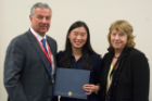 Aberlee Milliron received the Douglas S. Riggs Award for best academic performance in pharmacology coursework. Presenting were Margarita L. Dubocovich, PhD, right, and Michael E. Cain, MD.