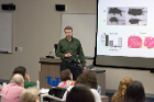 James Catlin, a PhD student in the Department of Biochemistry, discussing his presentation.